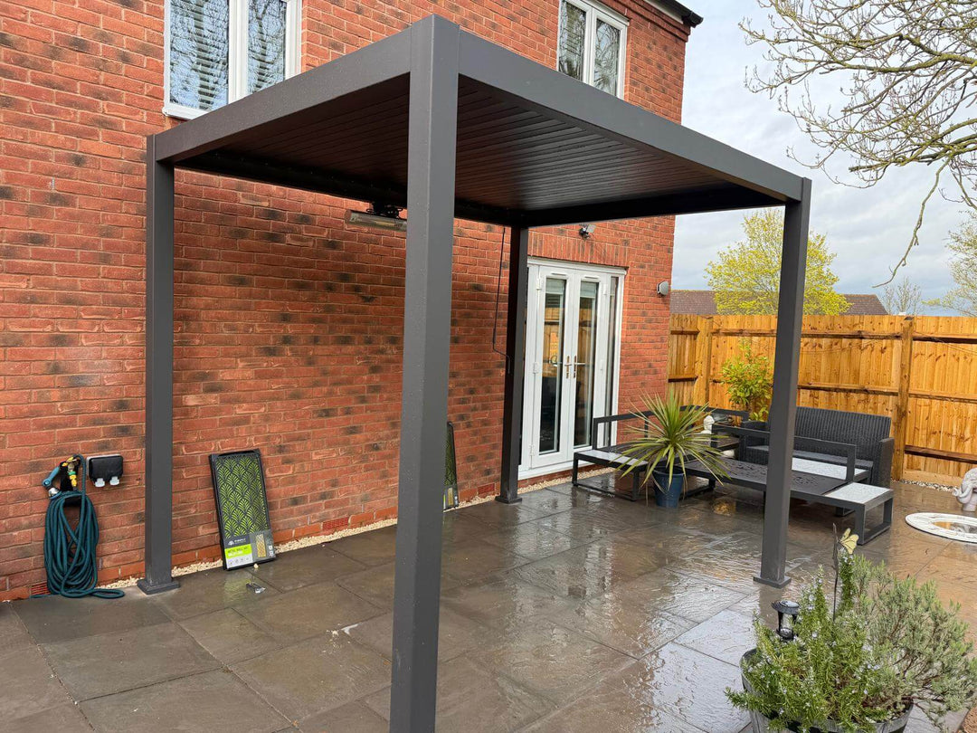 Nova Titan Pergola Installation in Cannock Chase, Cannock Staffordshire, Grey Pergola in back garden being installed on cloudy day.