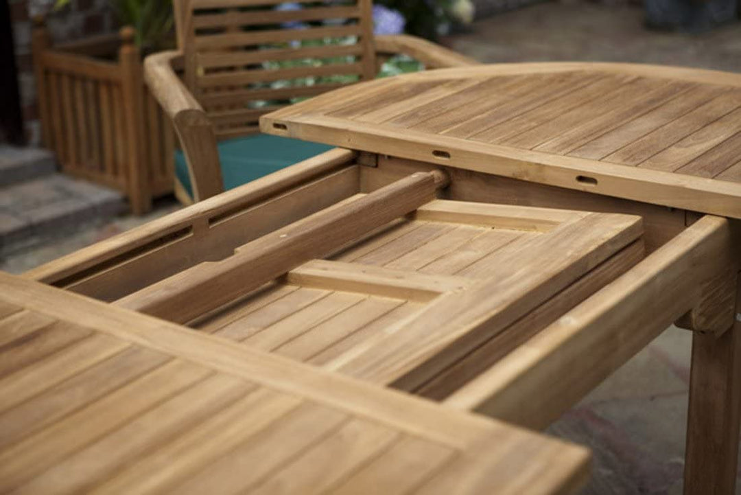 teak Wooden outdoor table with a folding leaf in an outdoor setting