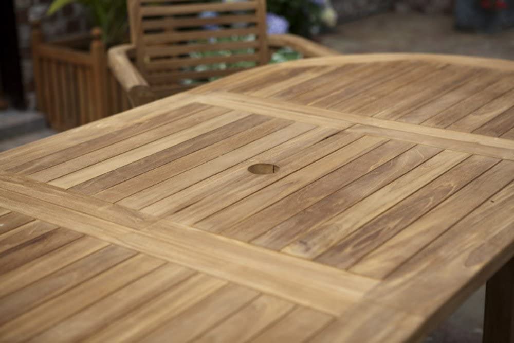 teak Wooden outdoor table with a chair in the background