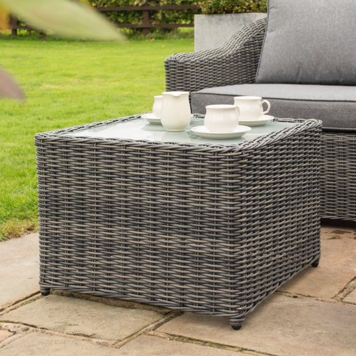 Bunbury Corner Garden Sofa Grey weave coffee table in outdoor garden.