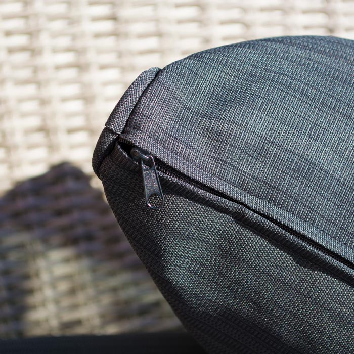 Midland Garden Furniture Heritage Collection Offley Garden furniture set, grey rattan and grey wooden legs on a sand stone patio. Close up image of dark grey cushion.
