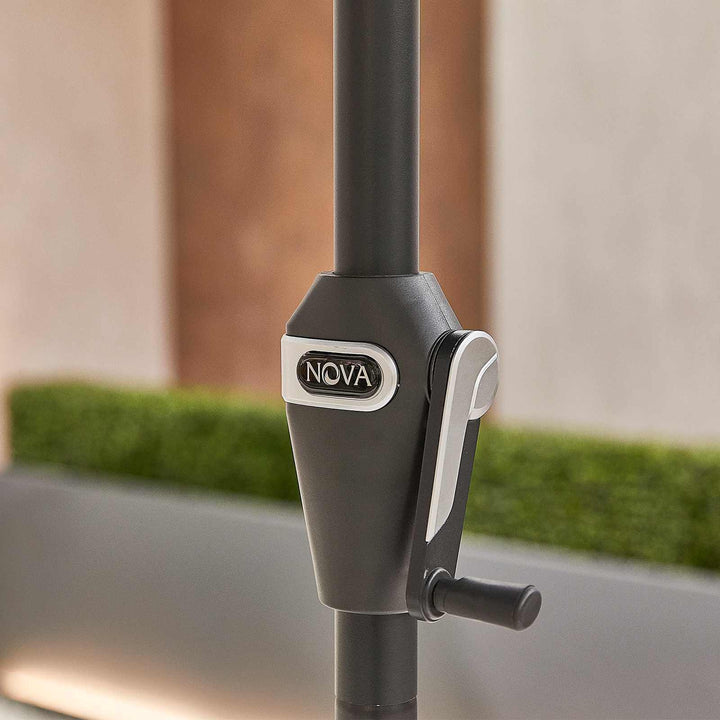 Close-up of a NOVA umbrella stand with a blurred outdoor background