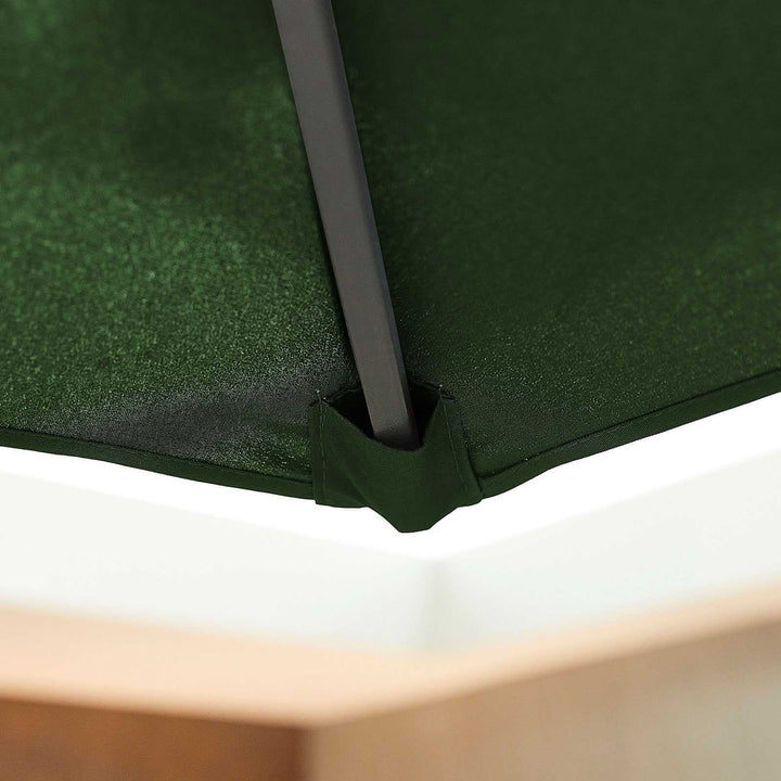 Close-up of a green NOVA Outdoor living parasol canopy with a white base and wooden arm.