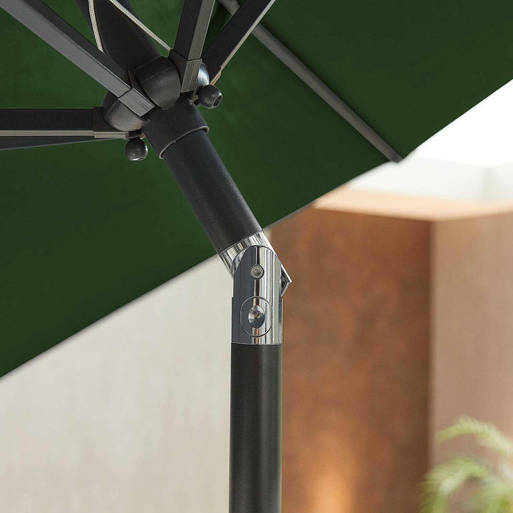 NOVA Outdoor living Close-up of a green patio umbrella with a black pole and silver bracket.