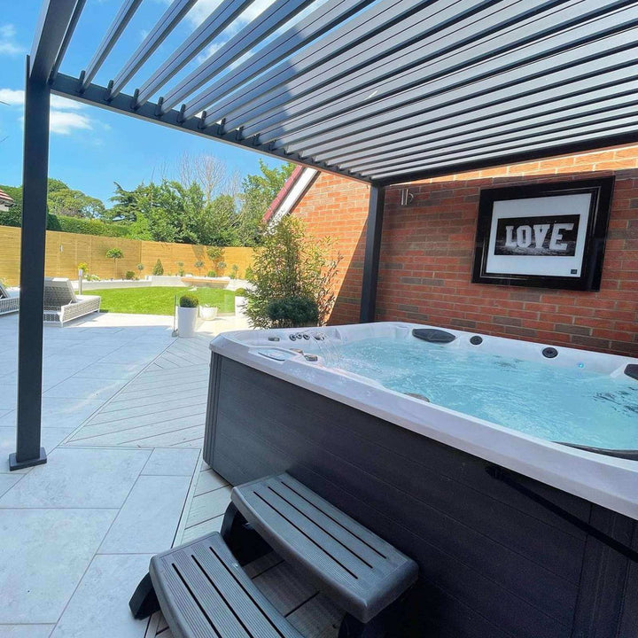 Nova Titan 3M x 3M Grey Pergola, with a brand new and modern hot tub underneath.