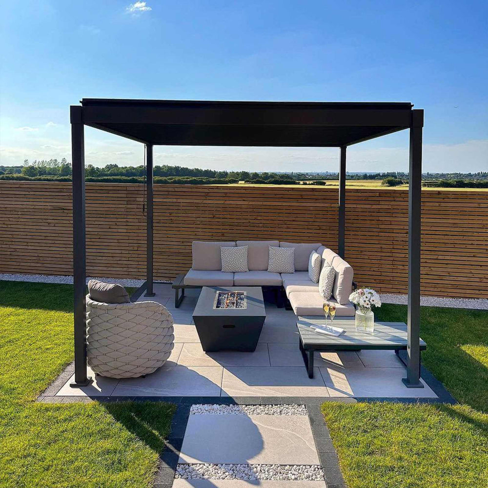 Outdoor patio area with Nova Luna pergola, sofa set, and fire pit table in a garden setting.