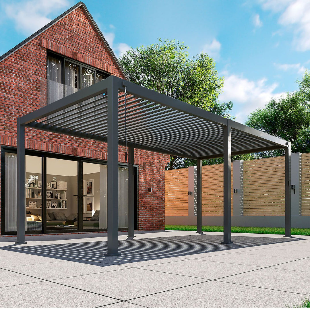 Nova Titan 6M x 3.6M Pergola Grey with 6 leg posts in front of brick house on grey slabs, Louvered Pergola Roof open, corner shot image
