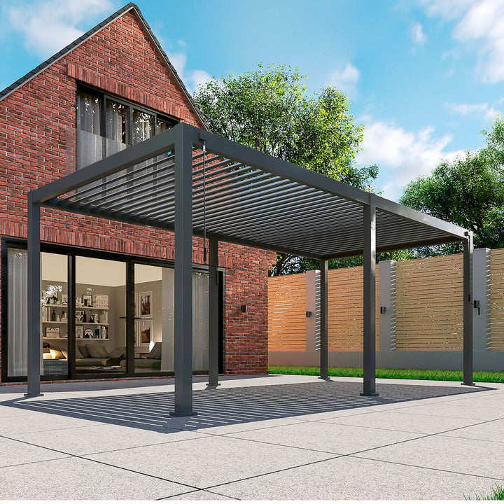 Nova Titan 6M x 3.6M Pergola Grey with 6 leg posts in front of brick house on grey slabs, Louvered Pergola Roof open, corner shot image