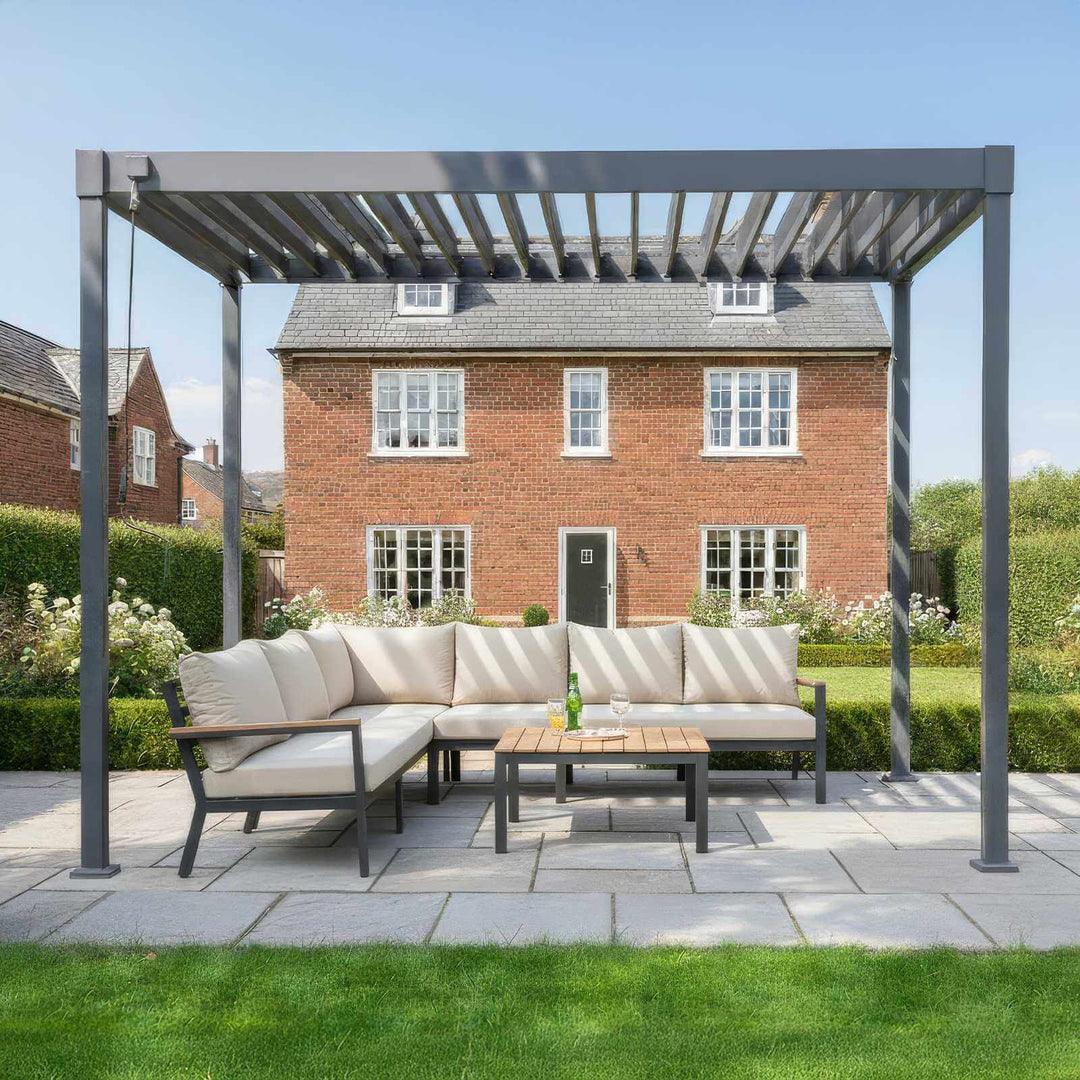 Outdoor patio set with Nova Luna pergola in front of a brick house