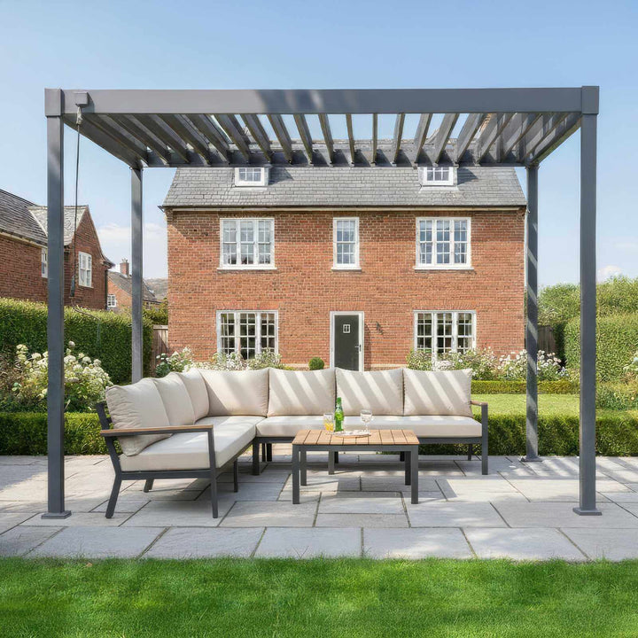 Outdoor patio set with Nova Luna pergola in front of a brick house