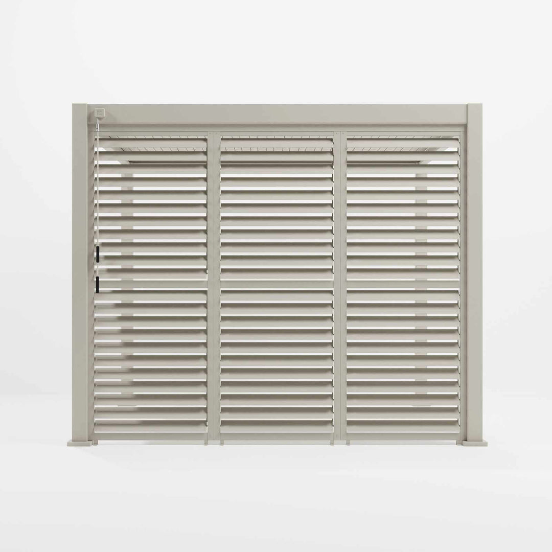 N24230-main Nova Titan Pergola Adjustable Louvered Walls Midland Garden Furniture. Aluminium Wall on white back ground with louvered slats, with louvers half open and 3 x 1M Sections all together in Pergola. Pebble colour.