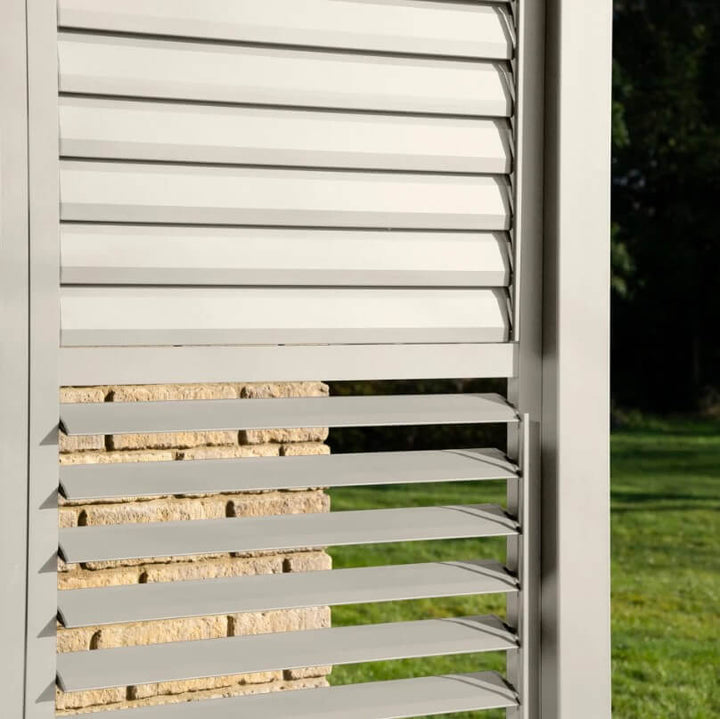 N24230-main Nova Titan Pergola Adjustable Louvered Walls Midland Garden Furniture. Aluminium Wall on white back ground with louvered slats, with louvers closed at the top and open at the bottom.