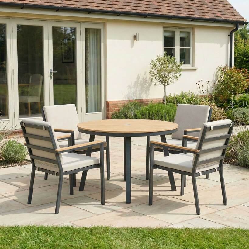 Nova Heidi outdoor living furniture set Midland Garden Furniture in front of a Cotswold house with plants at the back. 4 seater set. 