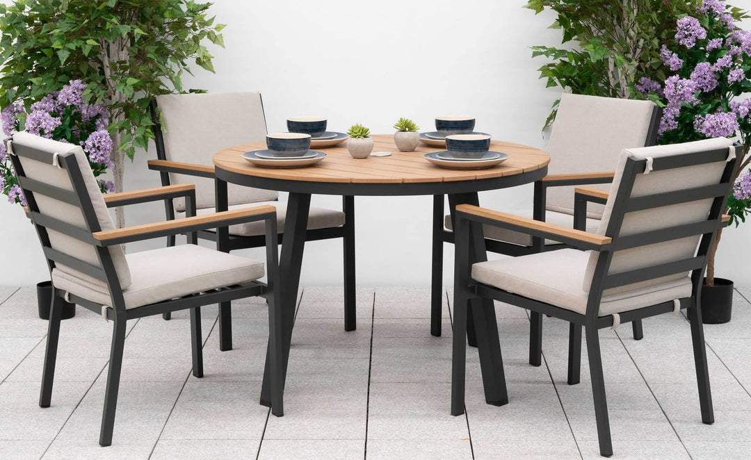 Nova Heidi 4 seater garden set with white back ground with wooden table top and grey aluminium frames, chairs with pebble/beige cushions.