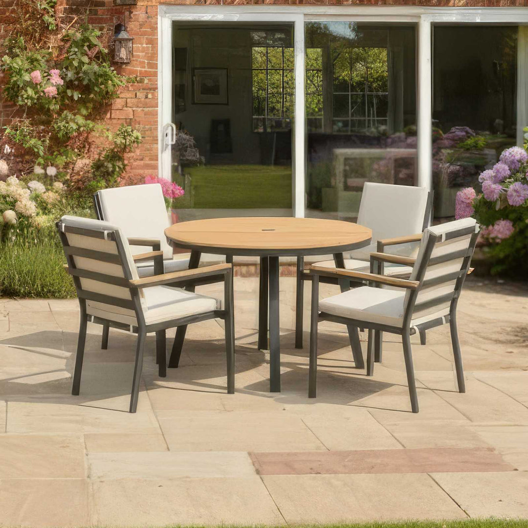 Nova Heidi 4 seater garden set in back garden with wooden table top and grey aluminium frames, chairs with pebble/beige cushions.