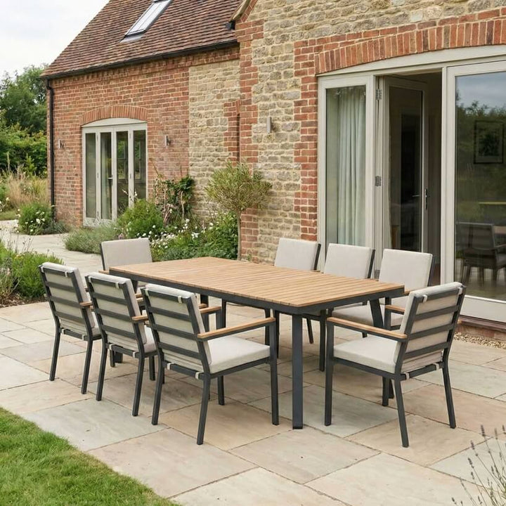 Nova Heidi outdoor living furniture set Midland Garden Furniture in front of a Cotswold house with plants at the back. 8 seater set. 