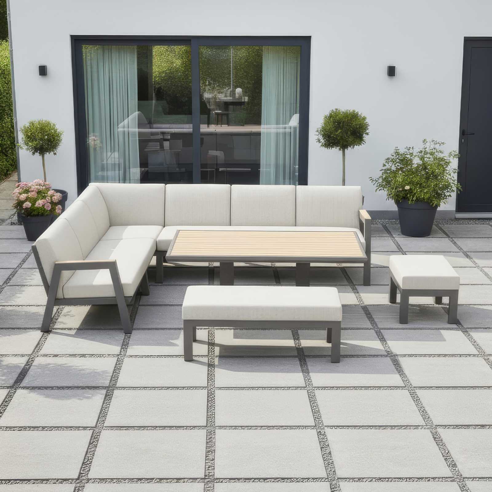 Nova Outdoor Living Hunter L shaped corner sofa with medium grey frame, light cream cushions and Hunter wood on table and arms.
