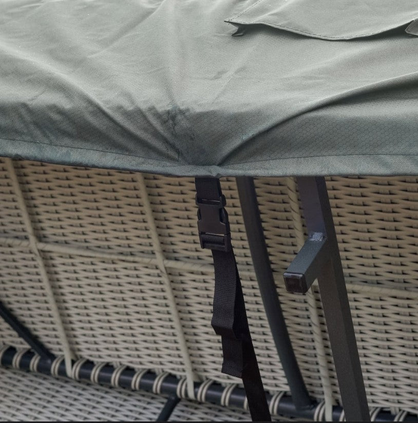 Rattan sofa shown from the bottom  with a grey Protex garden furniture cover and black metal frame with black buckle.