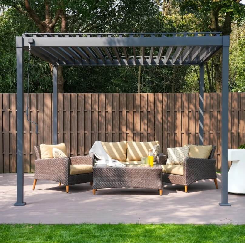 Outdoor patio set with Nova Luna pergola, chairs, and table on a tiles patio area.