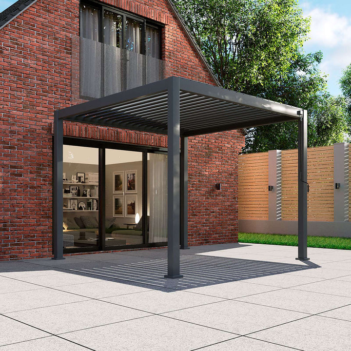 Nova Titan Pergola Grey against house brick wall, with patio doors opening under the pergola, installed on a bright clean stone colour patio on a bright day. 