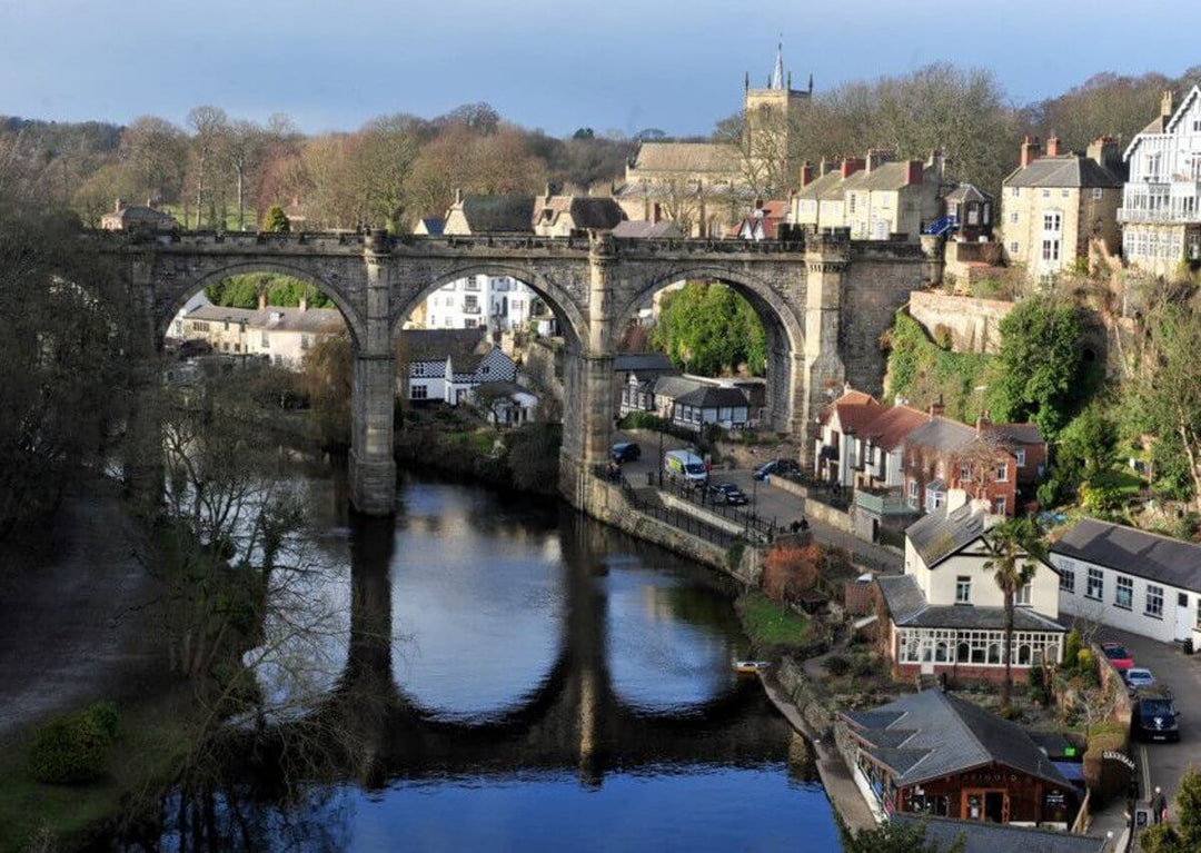 Pergola Installation Yorkshire depicted by Knaresborough Viaduct over the River Nidd with town buildings in the background